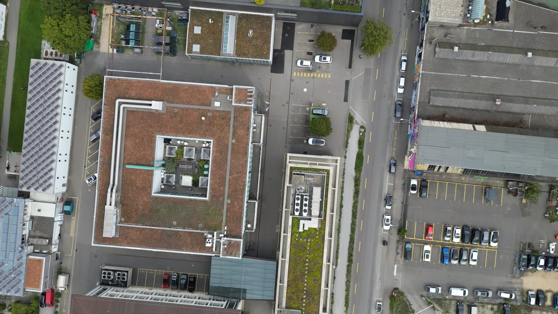 The arrangement of buildings, streets, and plots from above.