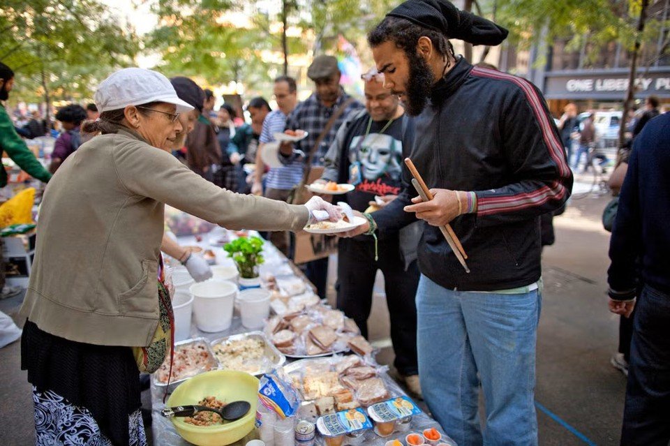 Sharing food at the Occupy kitchen. Source: The New York Times, 2011.